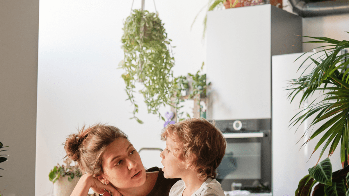 A woman talking with a child.